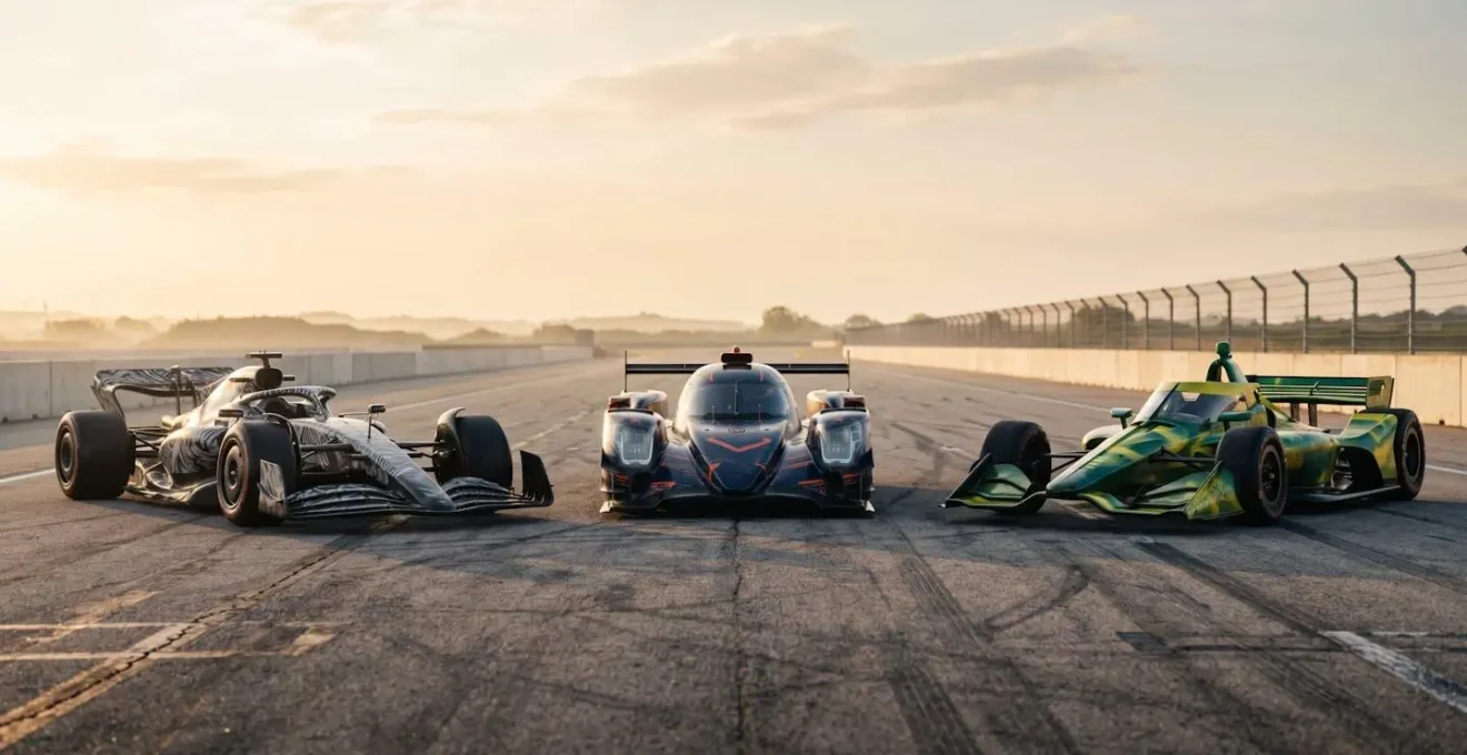 Three racing cars representing F1, WEC endurance, and IndyCar series side by side on a professional track
